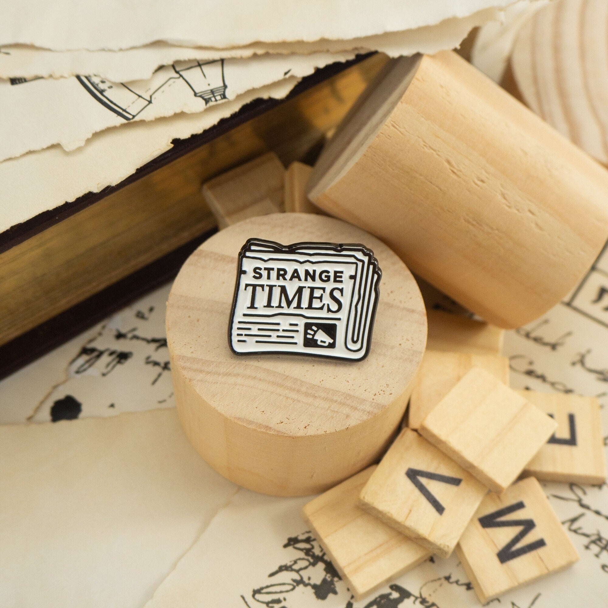 Strange Times Newspaper Enamel Pin
